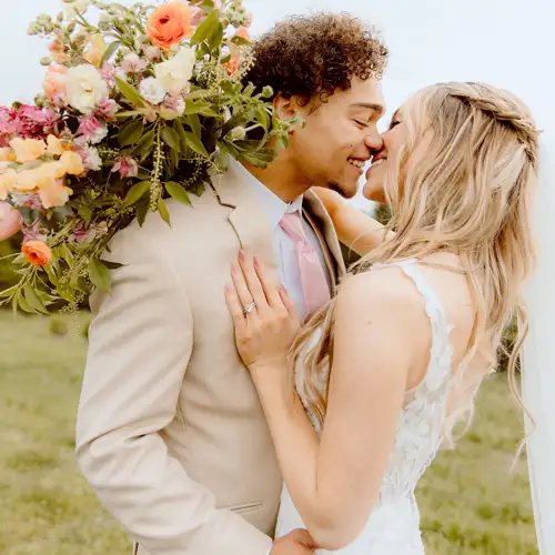 Groom kissing bride in his free rental